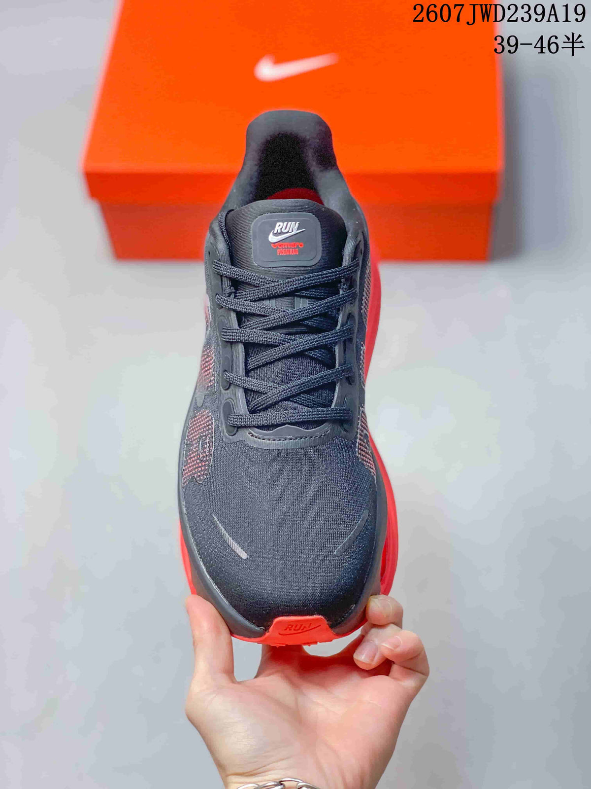 Top view showing the lace-up front, textured dark upper, and tongue branding.