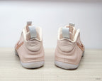 Rear view of the blush-pink high-top sneakers showing heel details and pull tabs