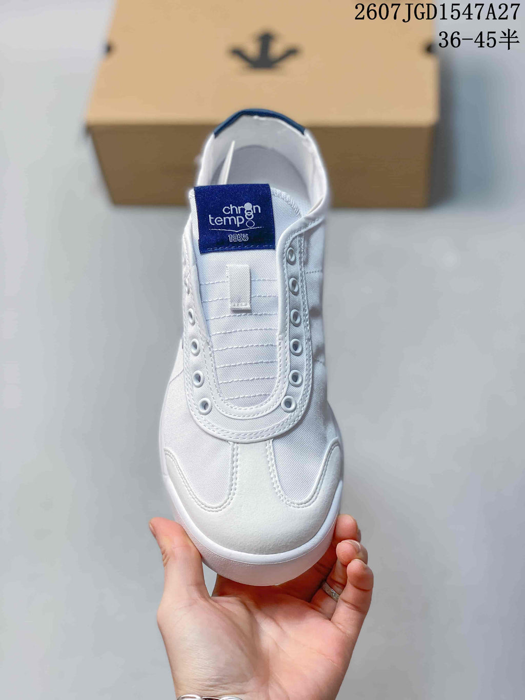 Top view of the white sneaker with a blue Cron Tempo tongue label and stitched toe panels.