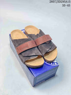 Pair of dark gray and brown Birkenstock Boston-style clogs displayed on a blue shoebox; overlay text shows style code 2607JXD295A15 and size range 35–45.