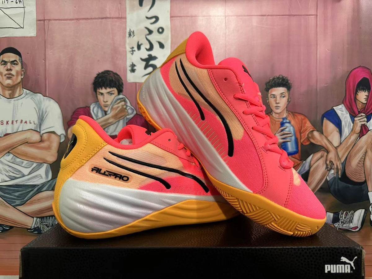 Pair of pink, gold, and white PUMA All-Pro basketball shoes shown at an angle.