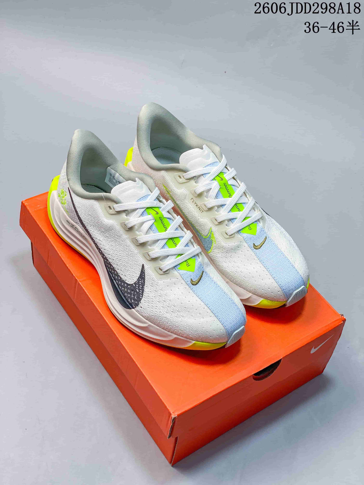White Nike Pegasus Plus Next Nature shoes with lime and pale blue accents