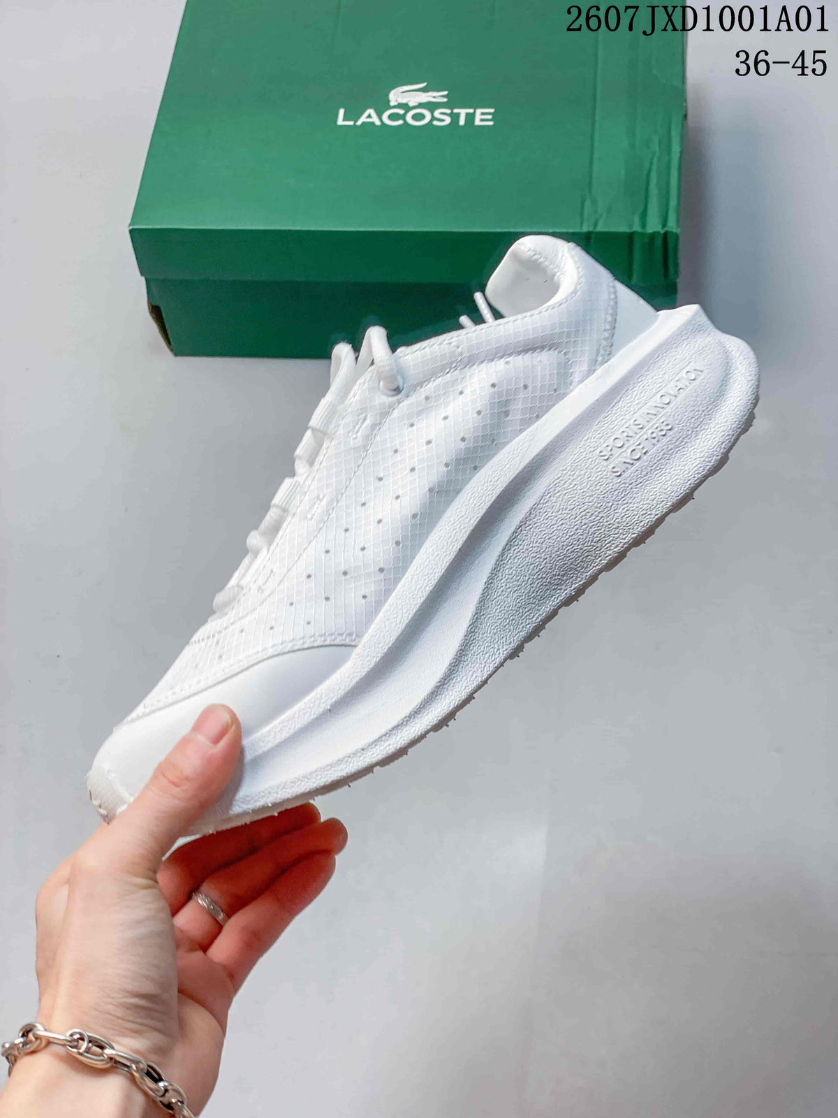Side profile of a white sneaker with perforated panels and a textured sole