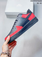 Side view showing the low-top profile, black Swoosh overlay and red paneling.