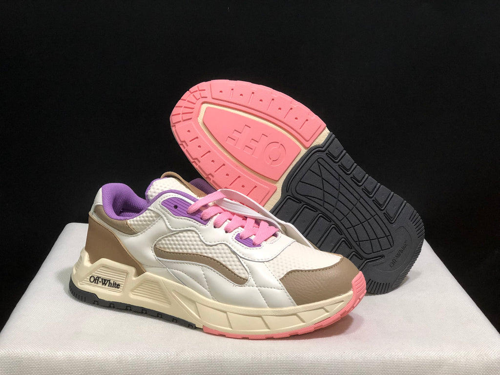 Angled view of one sneaker beside its outsole, showing the pink and black tread pattern and layered upper panels.
