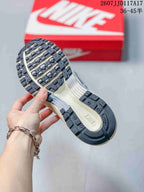 Underside view showing the segmented black and cream outsole tread of a Nike P-6000 sneaker.