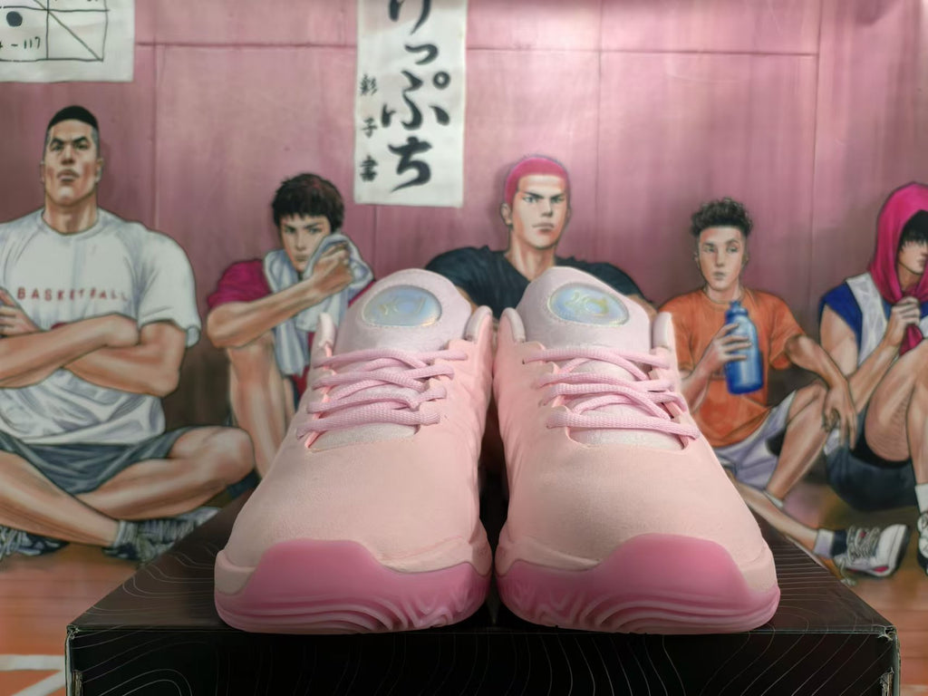 Front view of pink Nike basketball shoes with pink laces and matching toe and outsole accents.