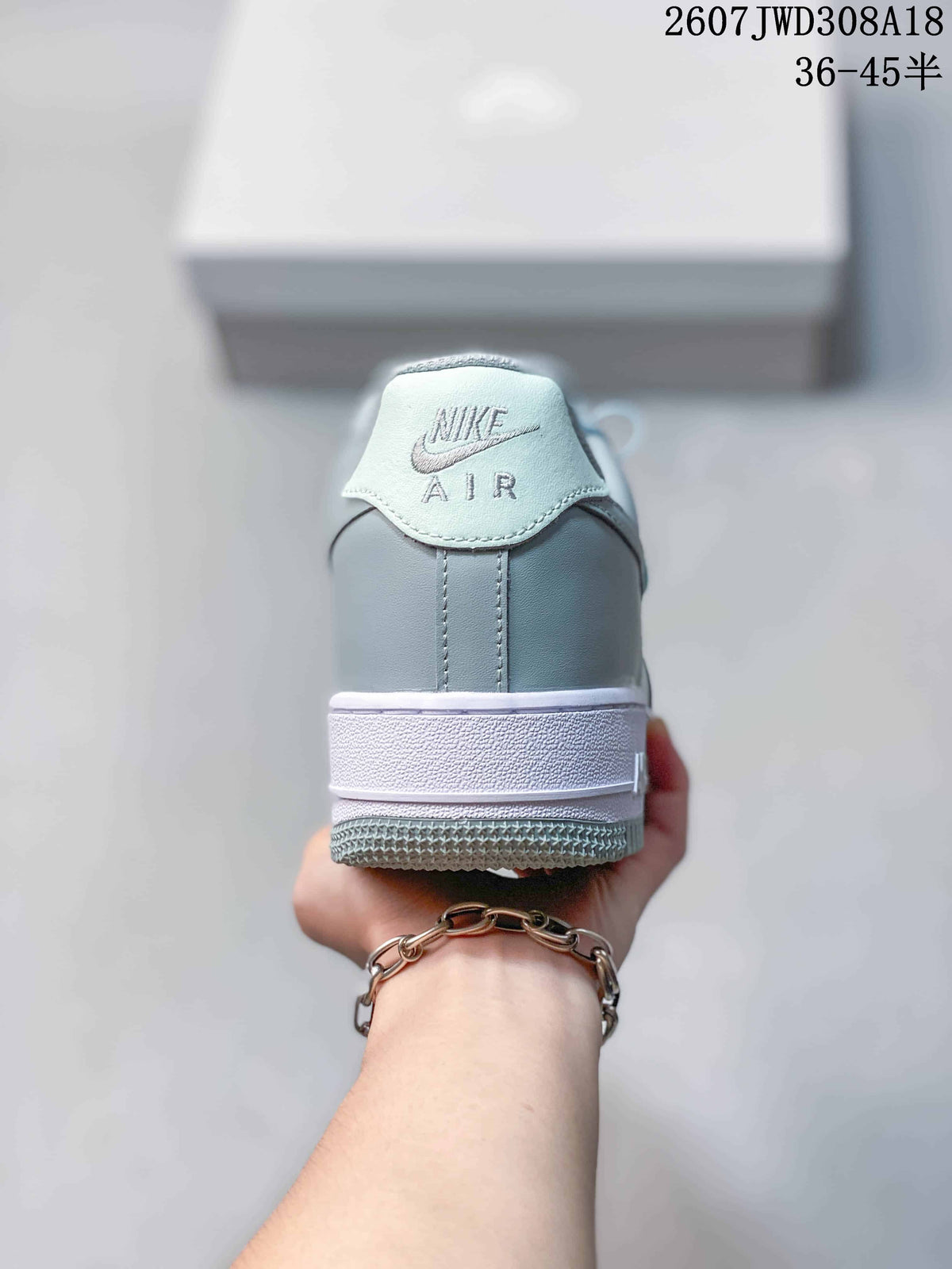 Rear view showing the padded heel, white midsole and Nike Air branding.