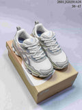 Gray and white ASICS GEL-NYC RGD sneakers displayed on an ASICS shoebox; image text shows 36–47.
