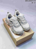Gray and white ASICS GEL-NYC RGD sneakers displayed on an ASICS shoebox; image text shows 36–47.