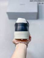 Rear view showing the navy heel panel, white heel tab and raised sole