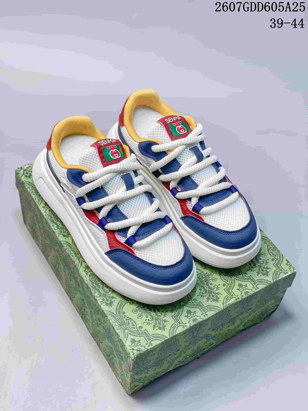 Pair of multicolor Gucci and Senma sneakers displayed on a patterned green box, with the source range 39–44 visible in the upper-right corner.
