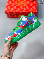 Side view of the multicolor Nike Ja 3 sneaker with a contrasting Swoosh and green outsole.