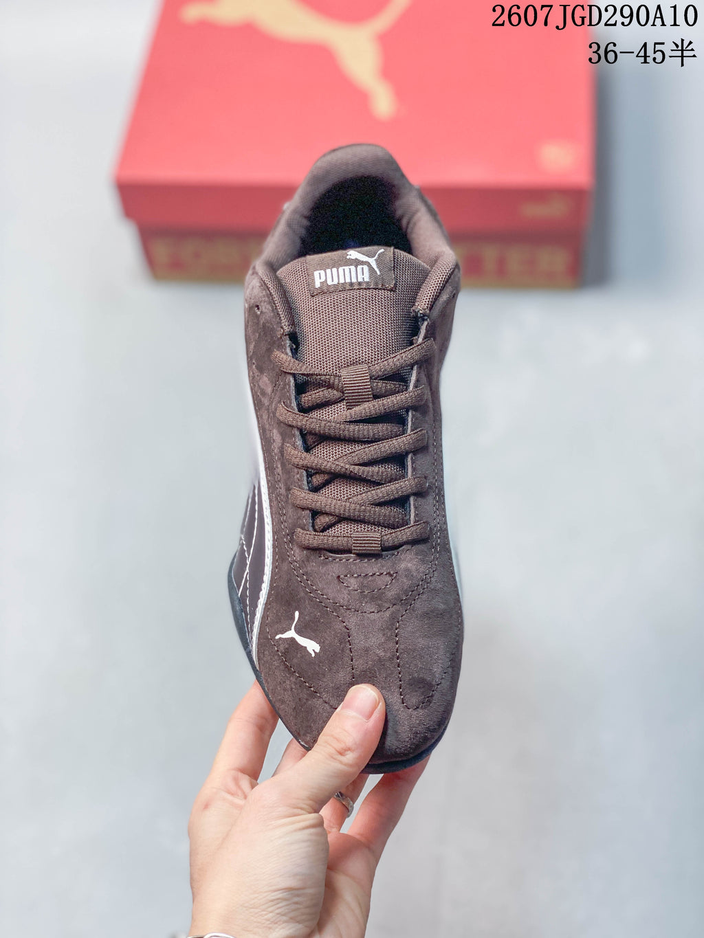 Top view of one brown sneaker showing the lace-up front, padded tongue and Puma branding.