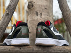 Rear view of the pair with dark heel details and red accents