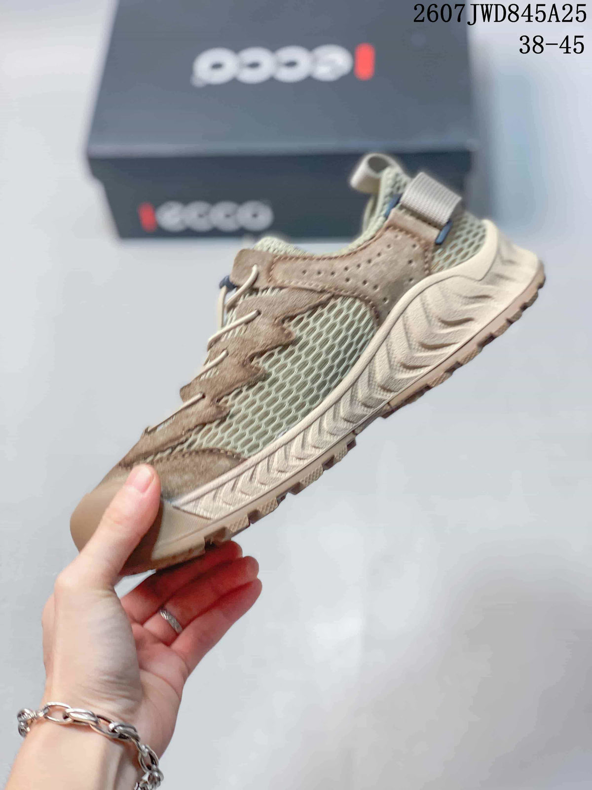 Side view highlighting the breathable mesh panels, overlay details, laces, and textured rubber sole.