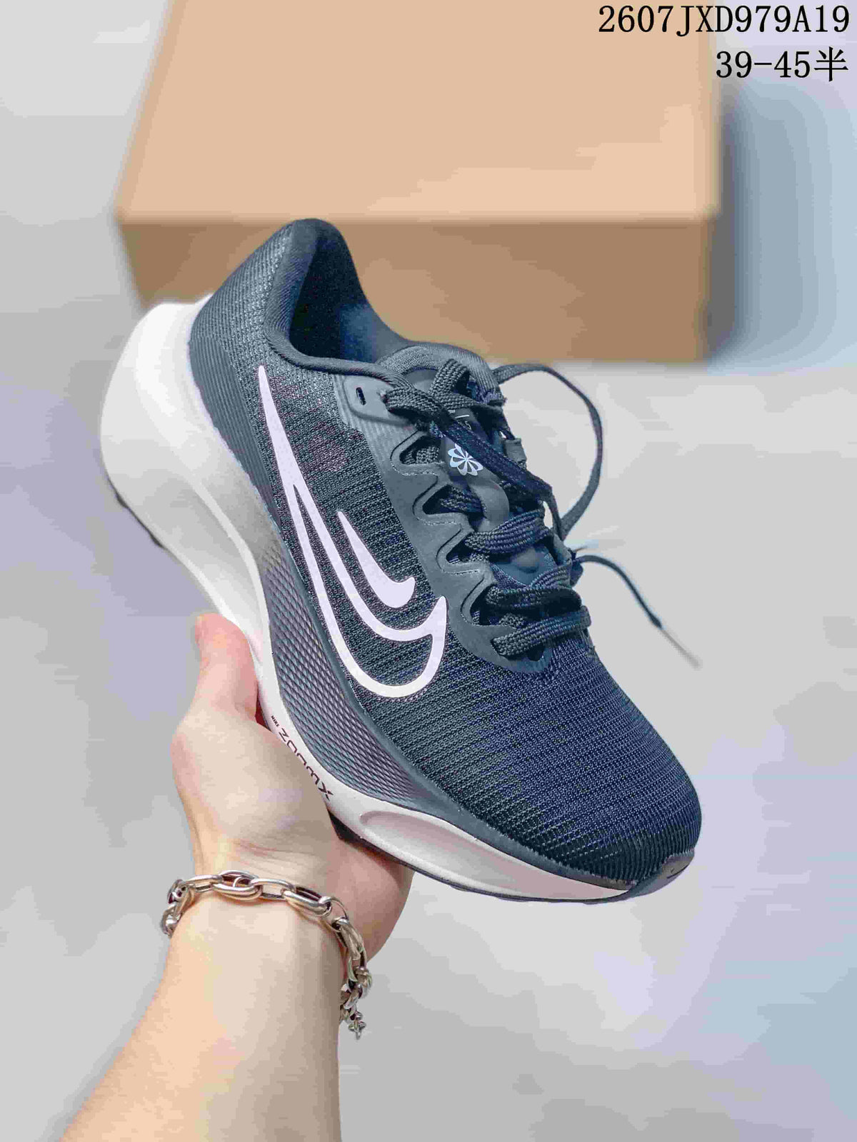 Dark navy Nike Zoom Fly 5 PRM sneaker with a pale side logo and white sculpted sole.