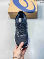 Top view showing the dark knit-style upper, lace system, padded tongue, and Asics branding.