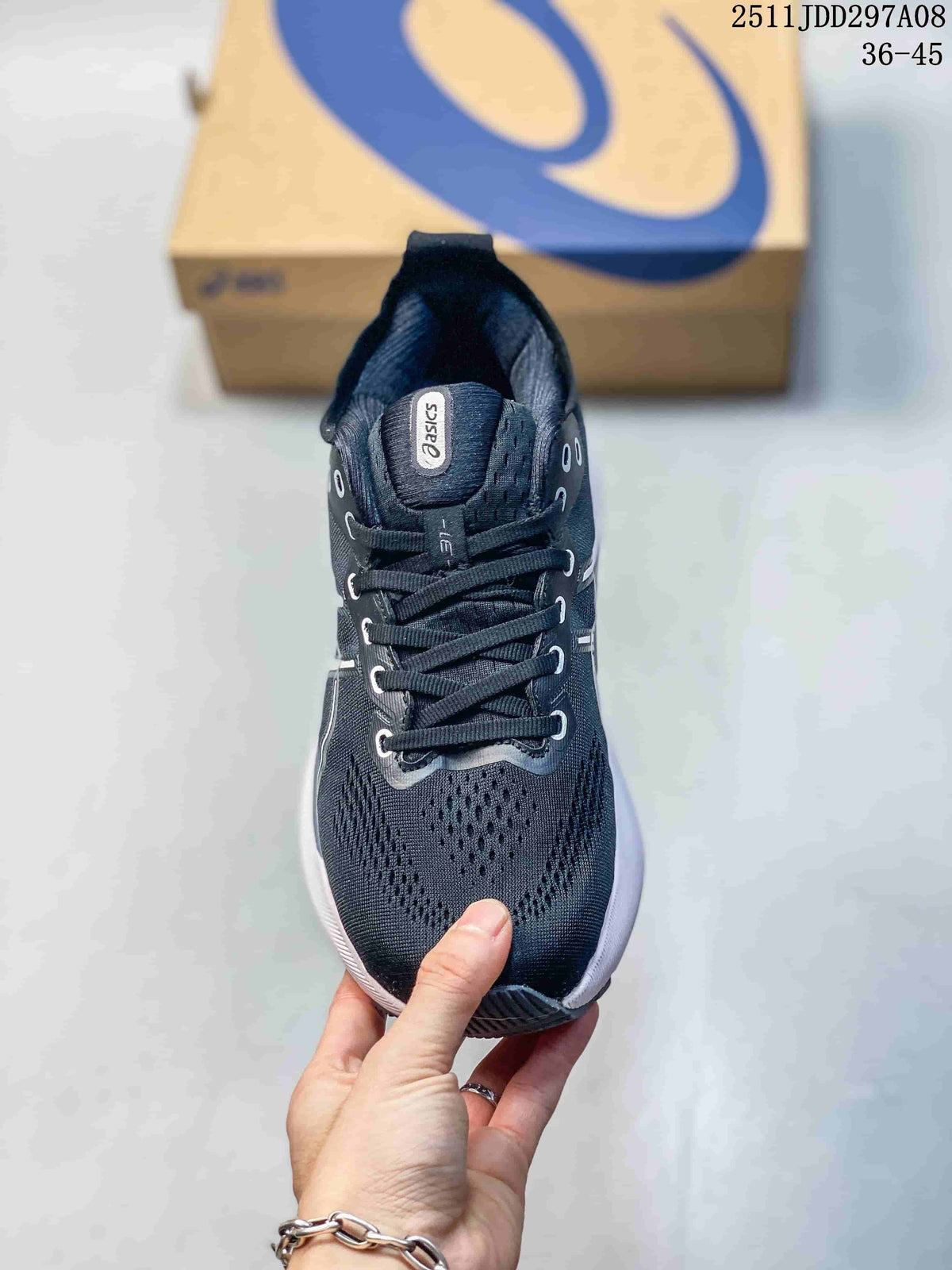 Top view showing the dark knit-style upper, lace system, padded tongue, and Asics branding.