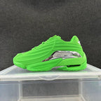 Bright green low-top sneaker with sculpted side panels and silver-look side accent