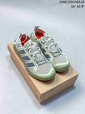 Pair of pale sage-green Adidas Terrex sneakers displayed on a box