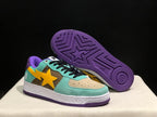 Angled view showing the mint green and brown upper, yellow star-shaped side detail, speckled white midsole, and purple outsole.