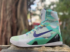 Side view of a gray, turquoise, green, and purple Nike Kobe 9 high-top shoe