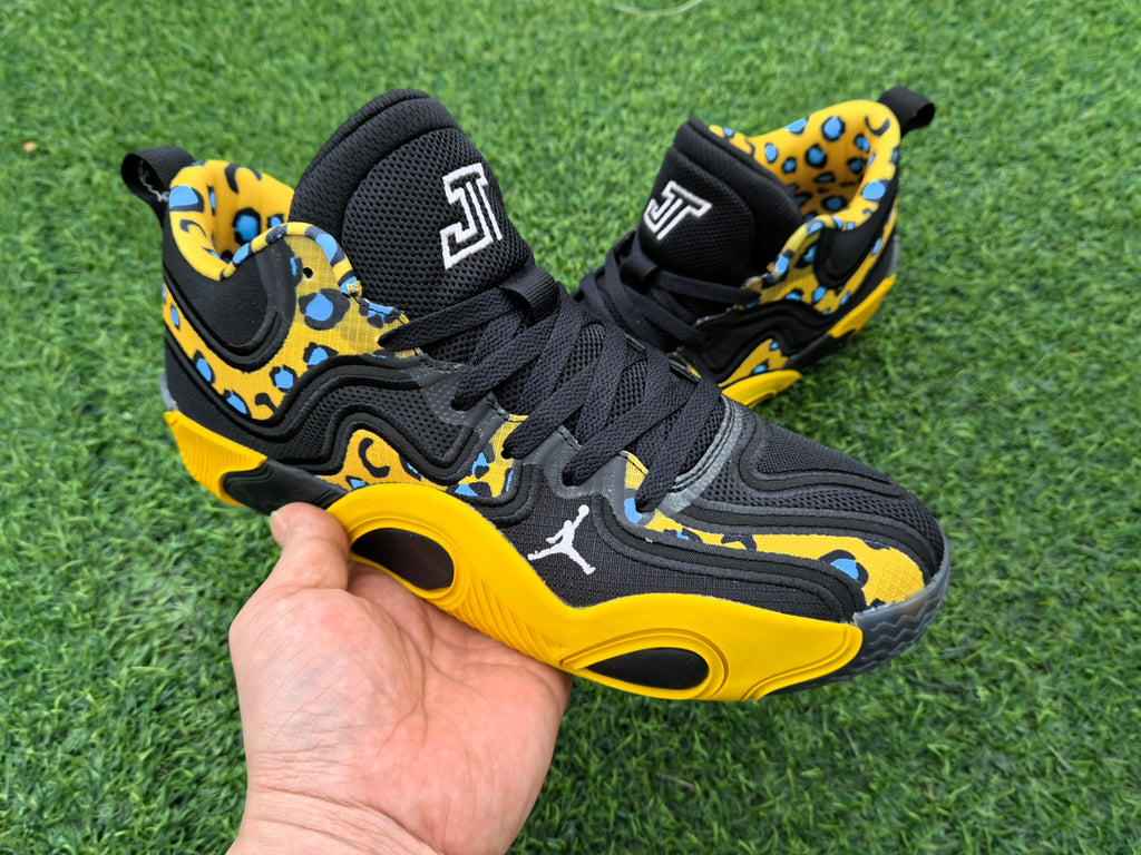 Side view highlighting the layered upper and yellow sole