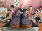 Front view of purple Nike GT Cut 3 basketball shoes with orange gum-colored outsoles.