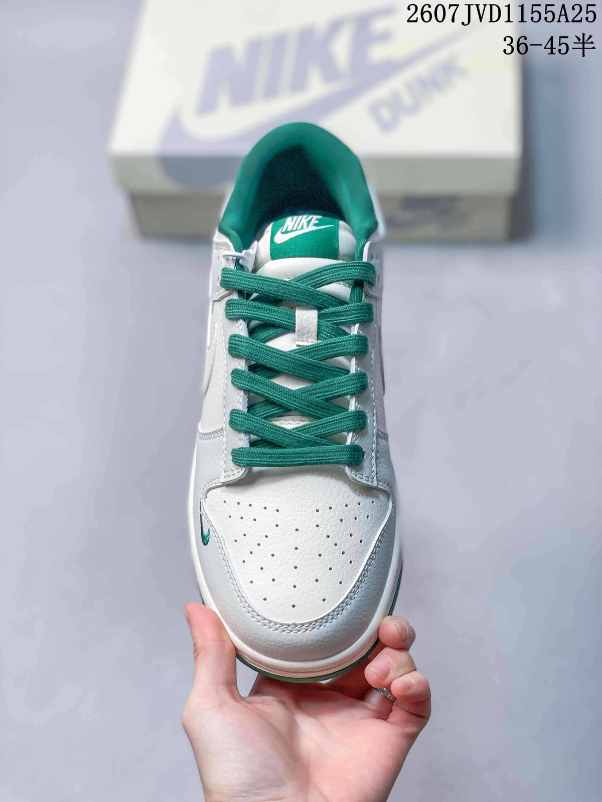 Top view showing the perforated white toe box, green laces, and green tongue branding.