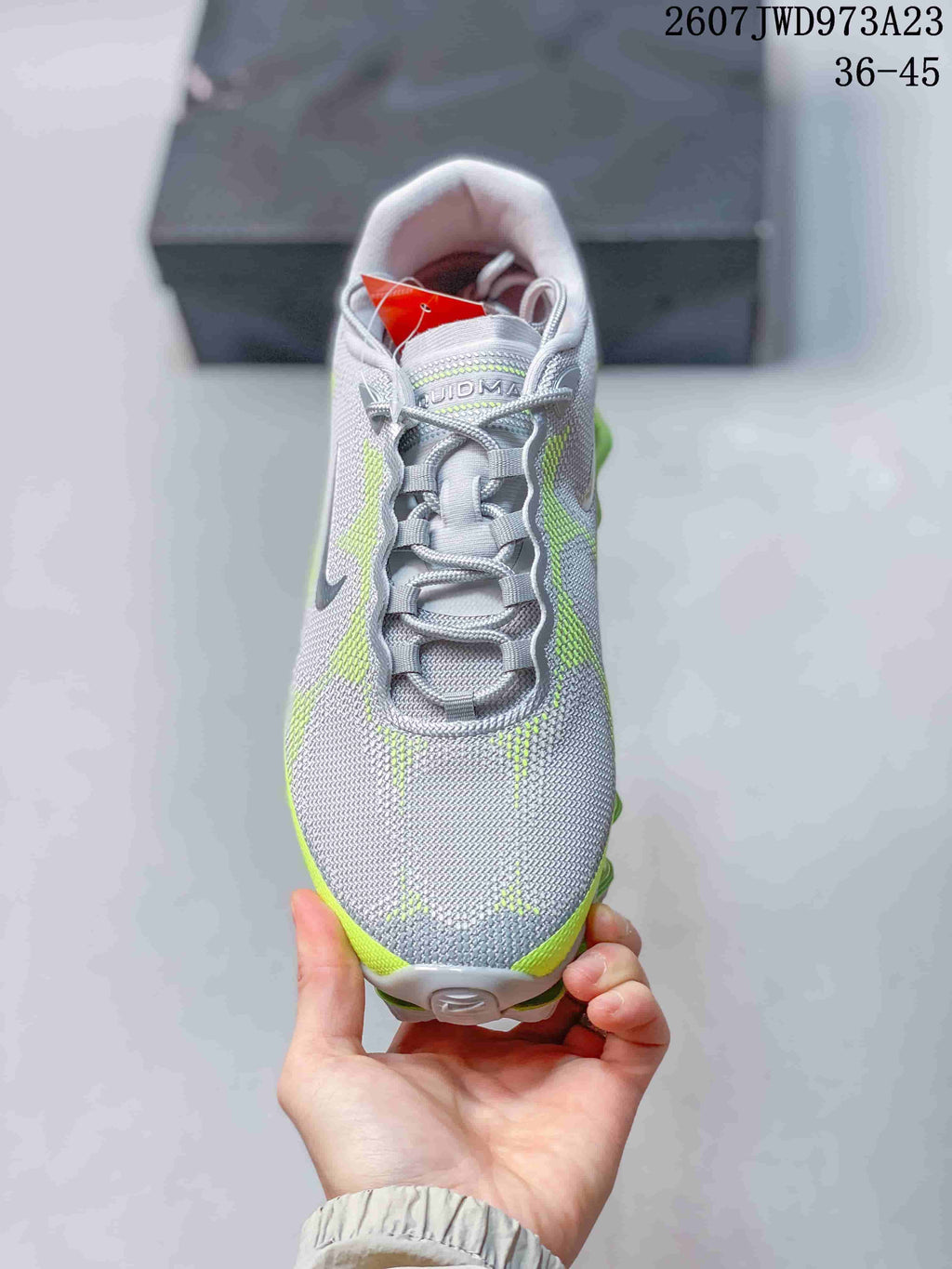 Top view showing the gray mesh-look upper, lace system, padded collar, and neon green accents.