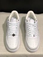 Overhead front view showing the lace arrangement, metal lace details, and perforated toe boxes.