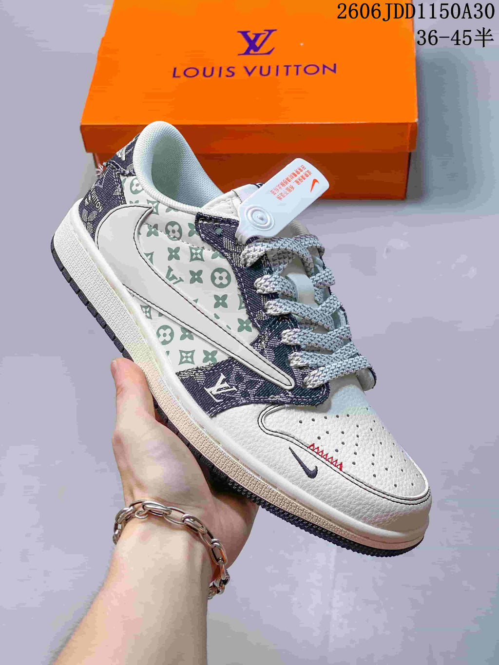 Side view of a white low-top sneaker with patterned overlays, contrasting laces, and perforated toe.