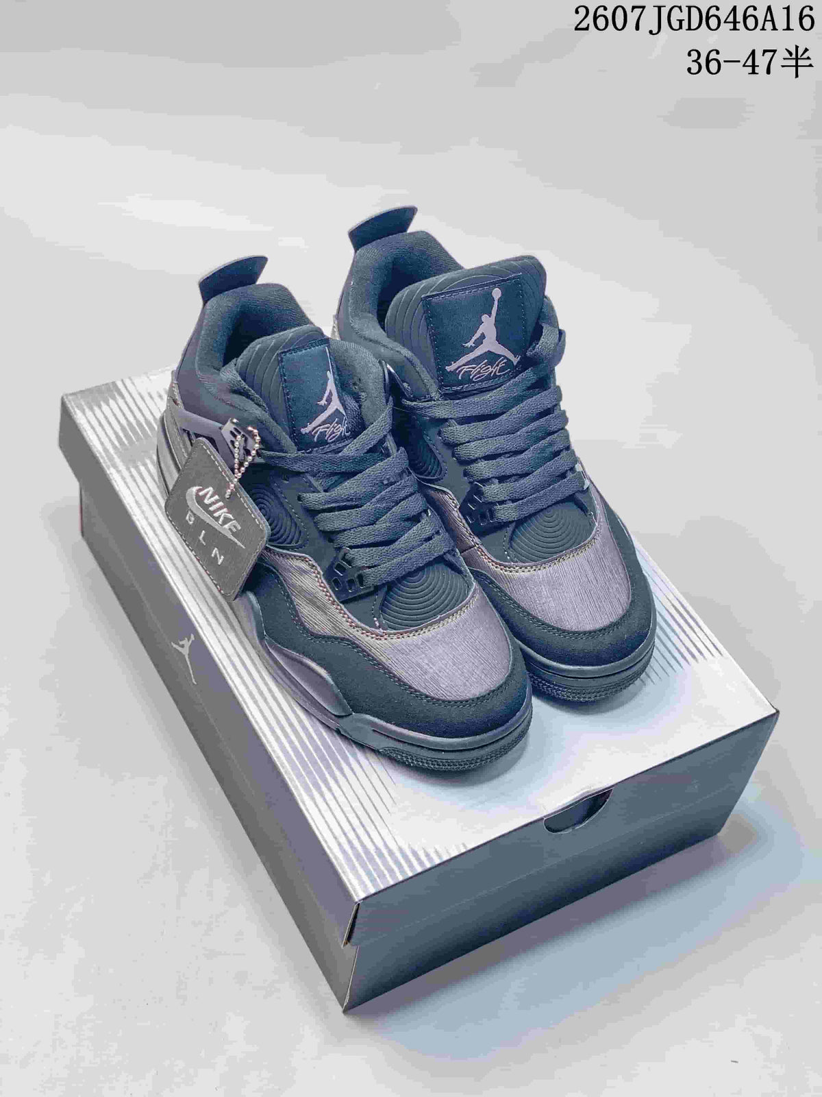 Pair of dark charcoal and black Jordan Air Jordan 4 Retro sneakers displayed on a shoebox.