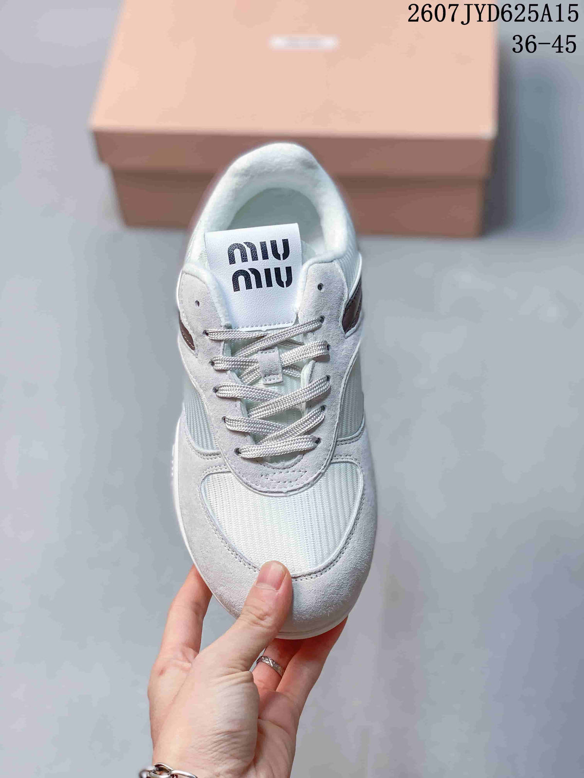 Top view of the sneaker showing tonal laces, white panels, burgundy side detailing, and Miu Miu branding on the tongue.