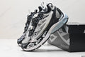 Black, white, and grey Off-White Be Right Back sneakers displayed beside their branded box.