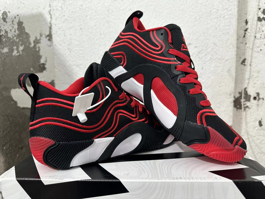 Pair of black-and-red Jordan Tatum 1 basketball shoes shown from the side