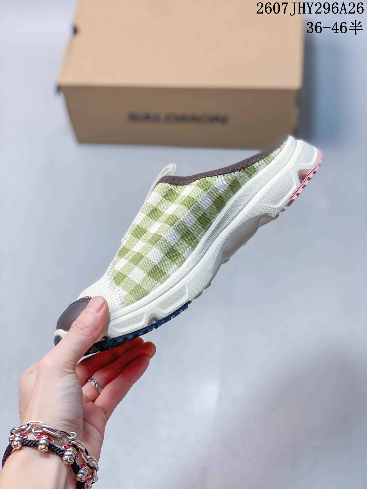 Side view of the Salomon slip-on showing the green check-pattern panel, white upper and textured outsole.
