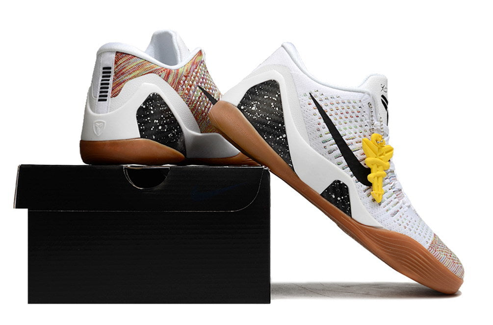 White and multicolor shoes with gum-colored outsoles displayed on a black shoebox.
