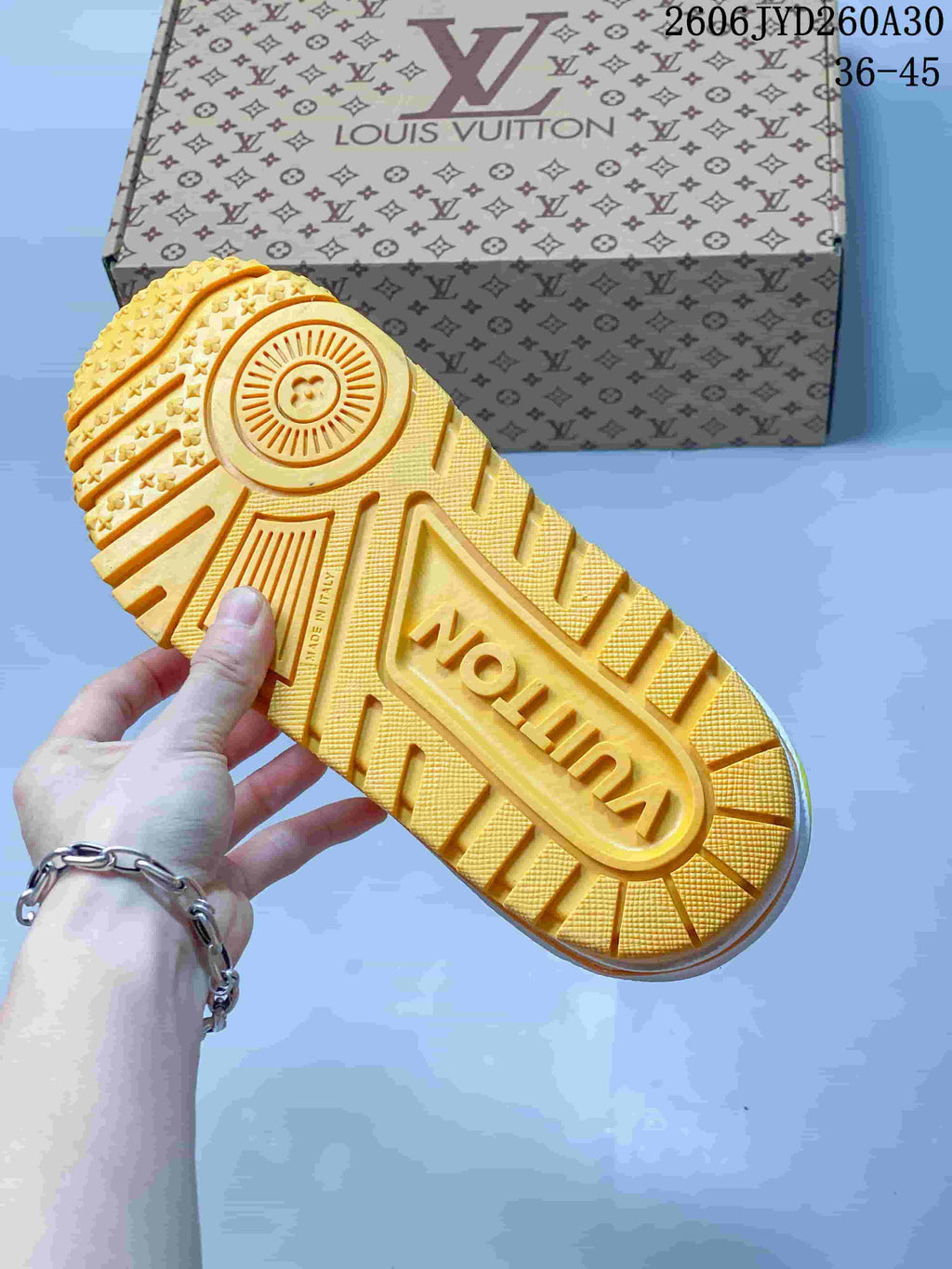 Close-up of the yellow lugged outsole on a Louis Vuitton Trainer Maxi sneaker.