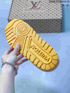 Close-up of the yellow lugged outsole on a Louis Vuitton Trainer Maxi sneaker.