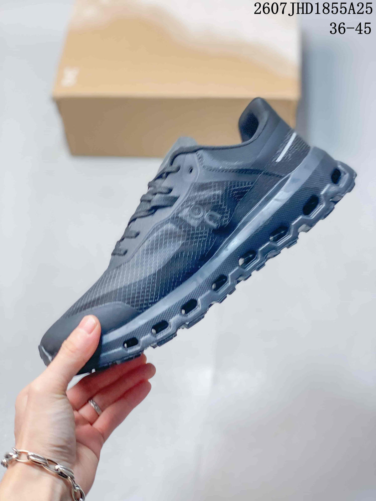 Side view of the On Cloudvista 2 sneaker showing the textured upper, layered side panel, lace-up construction, and lugged outsole.