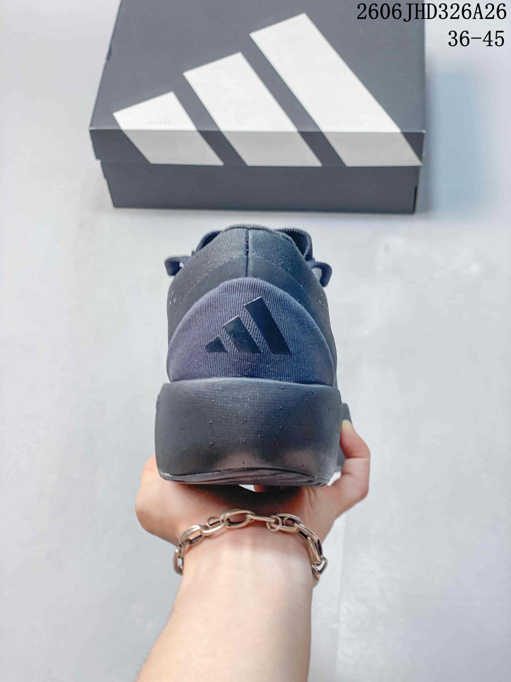 Rear view of the charcoal running shoe showing the heel and logo detail