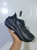 Angled view of the black Balenciaga sneaker showing the branded upper, lace fastening and layered outsole.