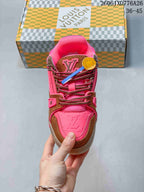 Front view highlighting the sneaker tongue, laces, and pink toe area