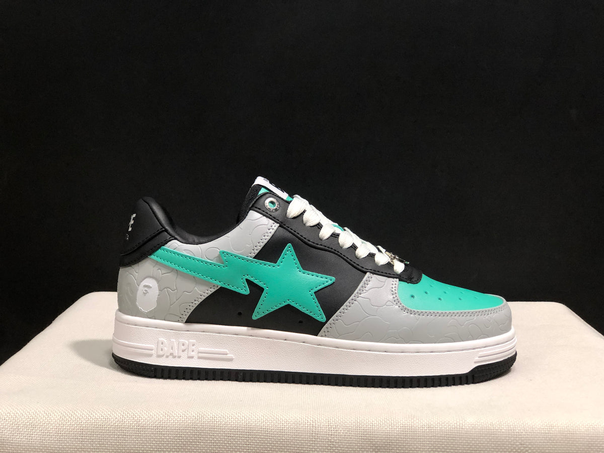 Side profile of one BAPE Bape Sta sneaker showing the white BAPE-marked midsole and black outsole.