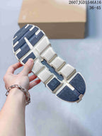 Close-up of the segmented sneaker outsole showing white and dark traction sections.
