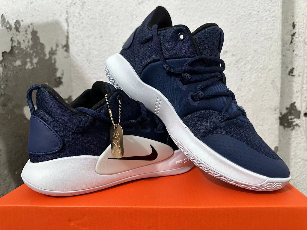Pair of navy blue Nike basketball shoes shown from multiple angles