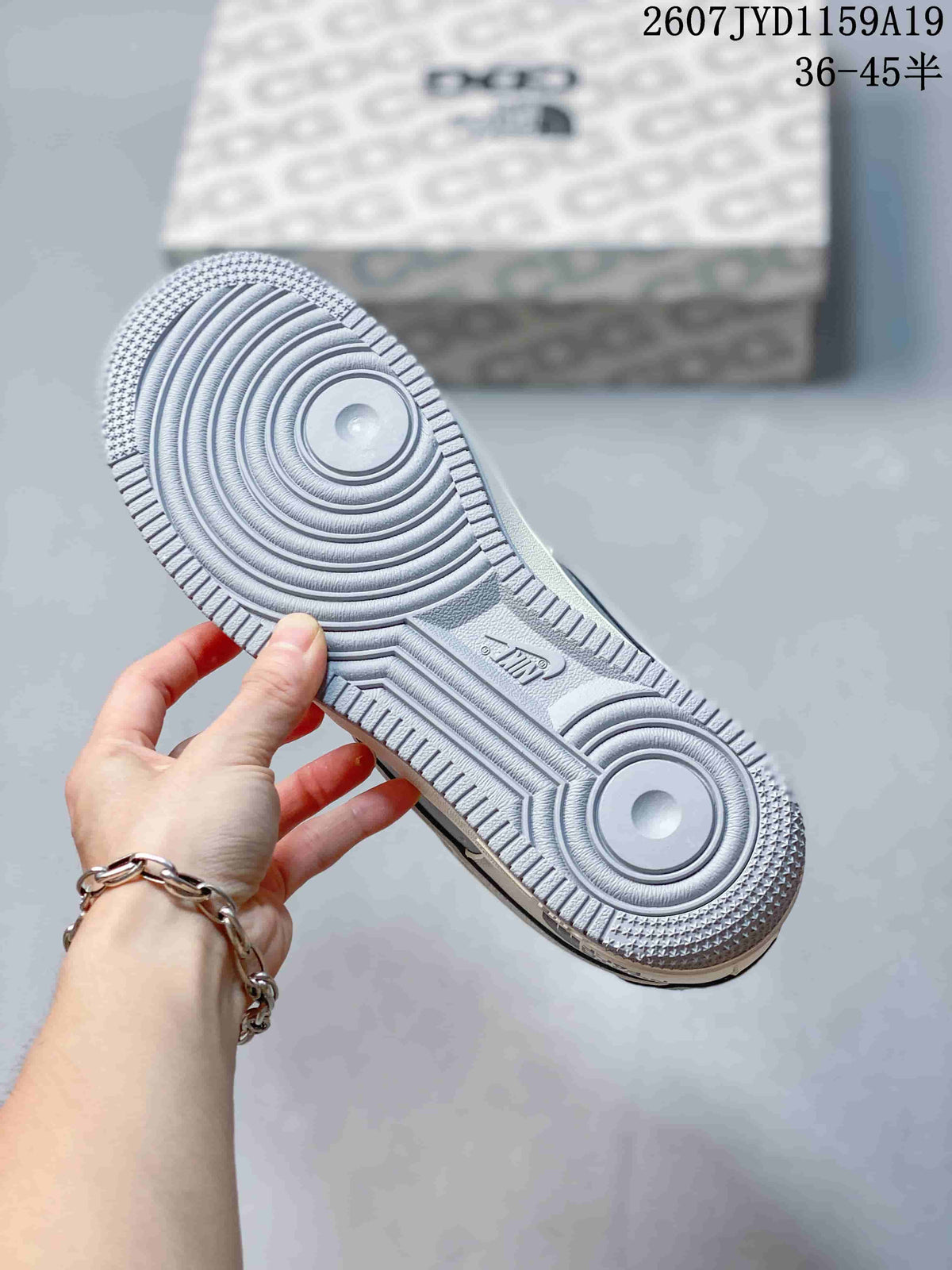 Close view of the textured rubber outsole with circular traction grooves.