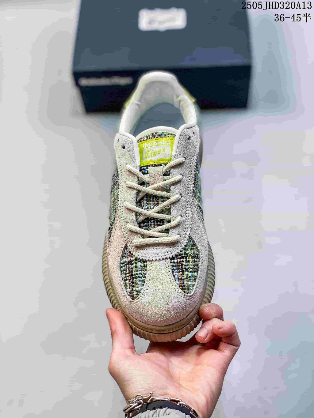 Front view showing the laces, patterned panels and lime tongue label